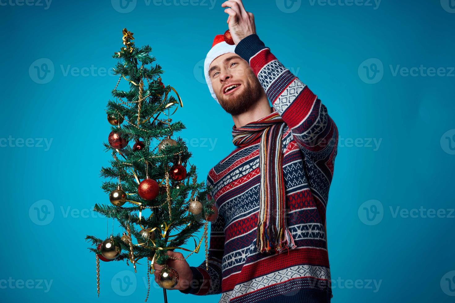 handsome man in a santa hat holding a banner holiday isolated background photo