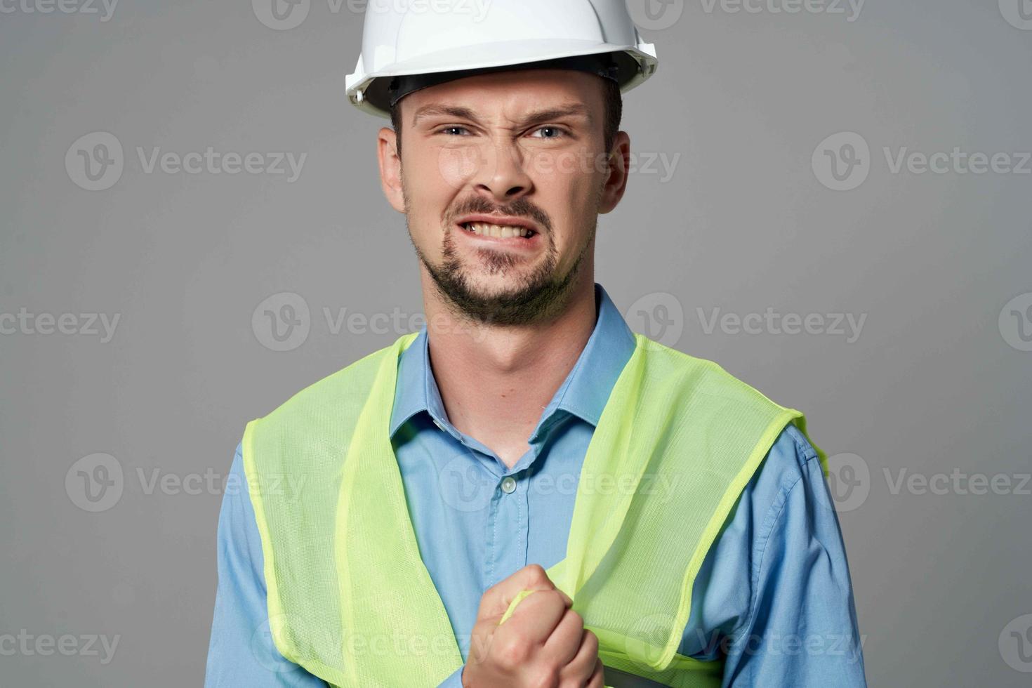 man in construction uniform Professional Job light background photo