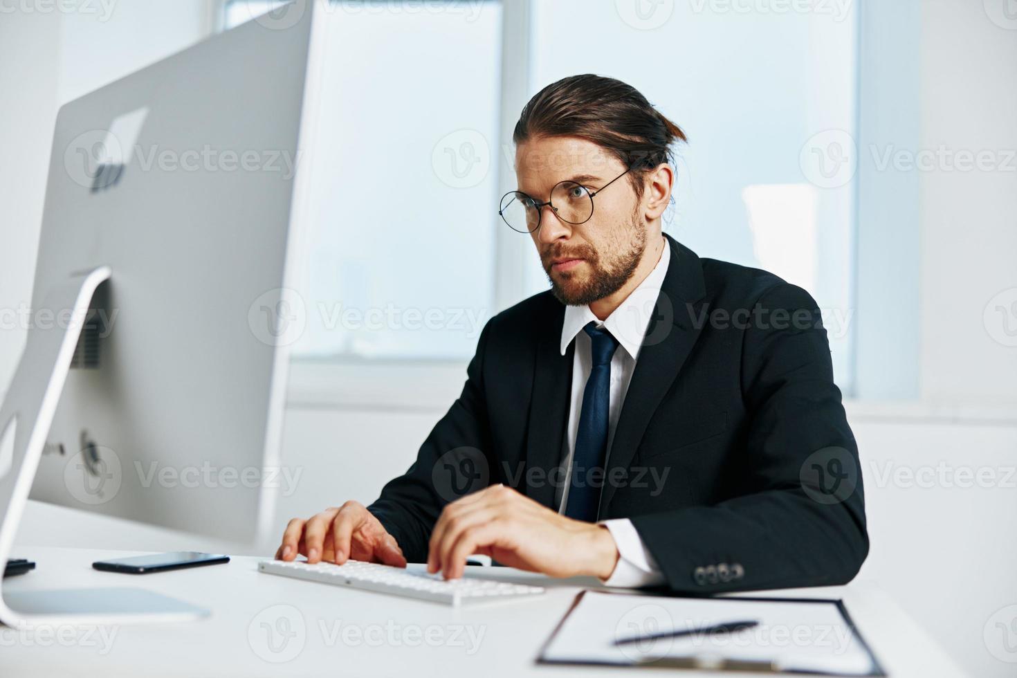 male manager an official is working at the computer Chief photo