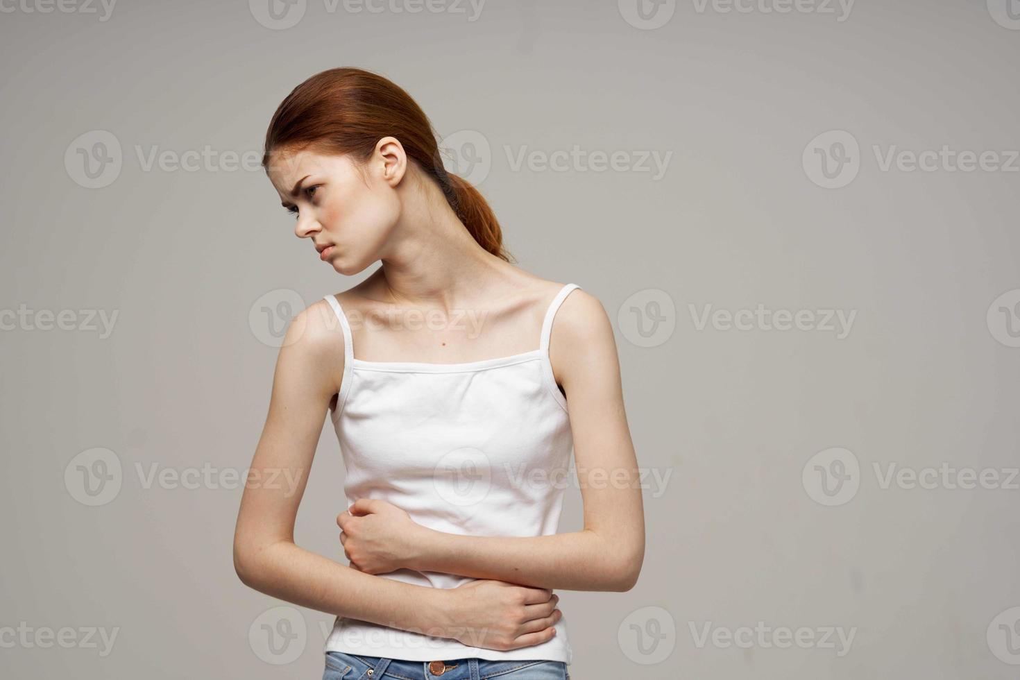 sick woman groin pain intimate illness gynecology discomfort light background photo