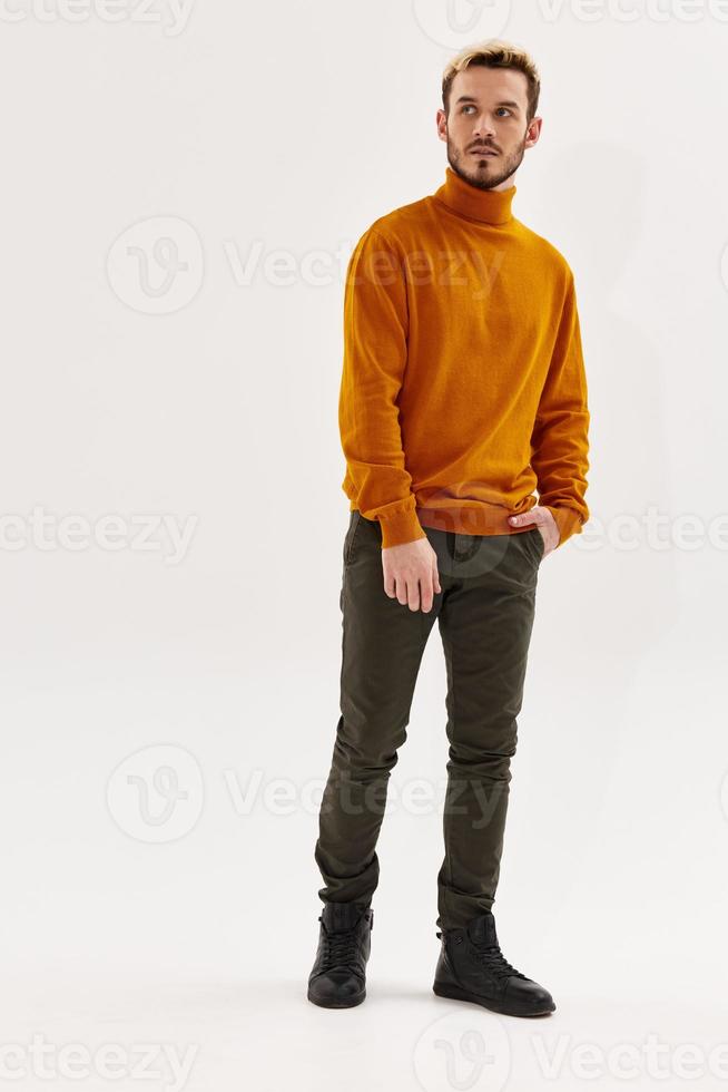 handsome man brown sweater autumn style Studio fashion full length photo