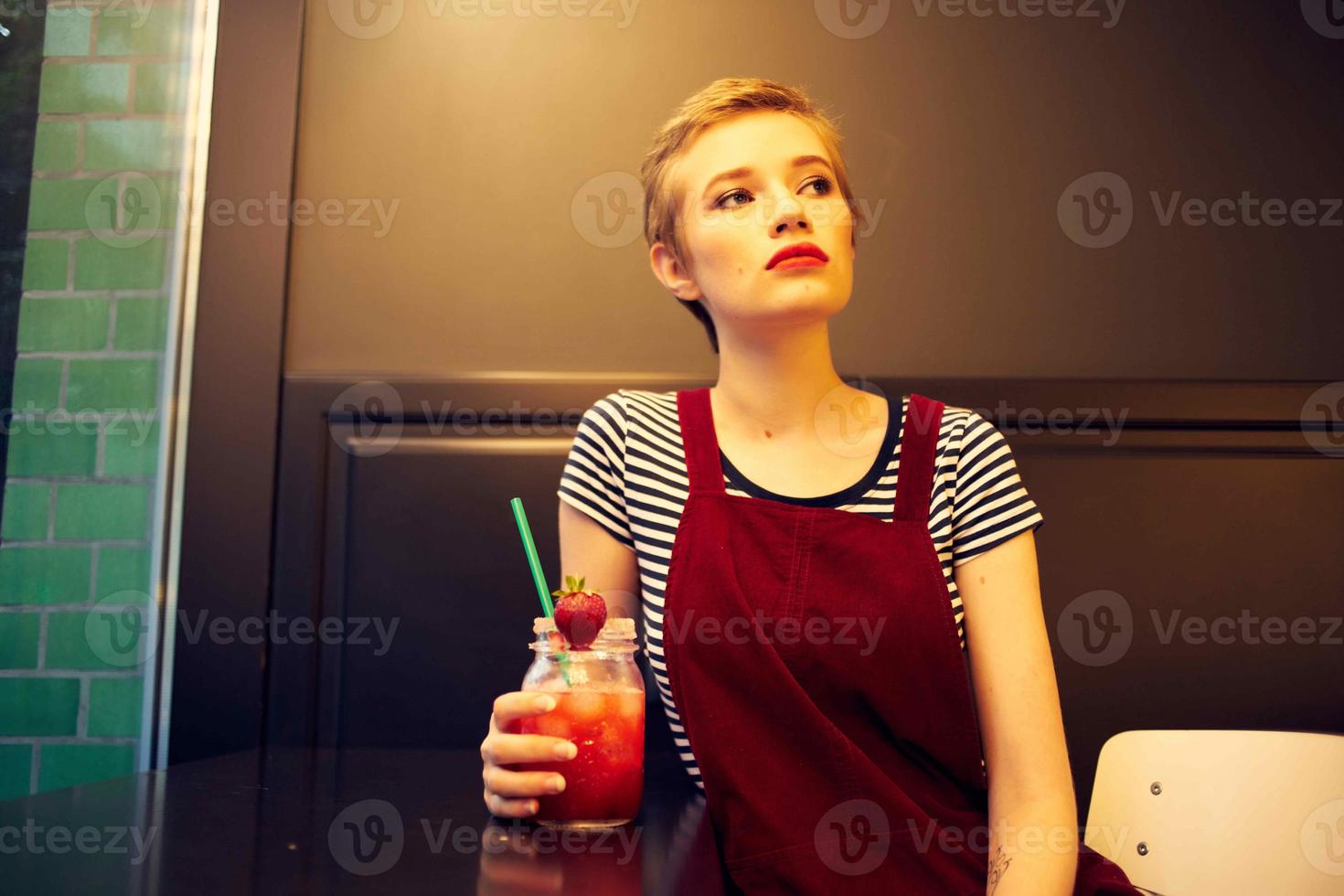 woman with short hair sitting in cafe cocktail vacation lifestyle photo