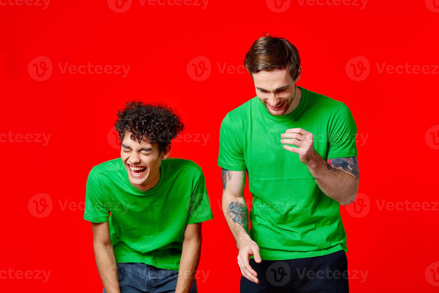 two friends green t-shirts fashion casual clothing studio photo