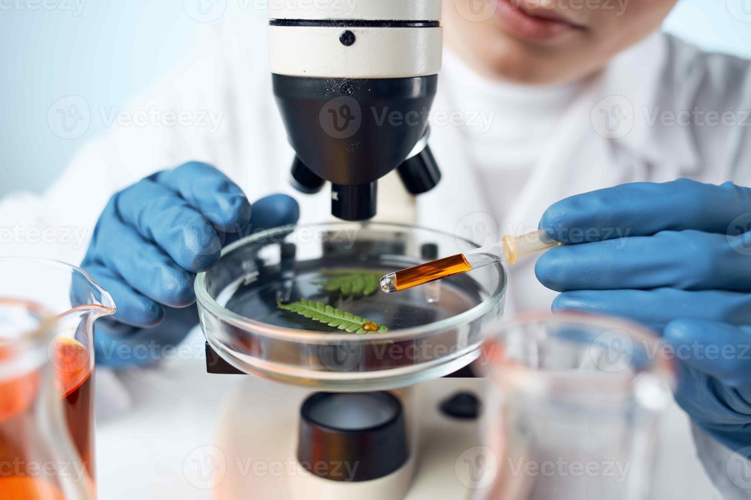 Laboratory technician blue gloved microscope professional technology photo