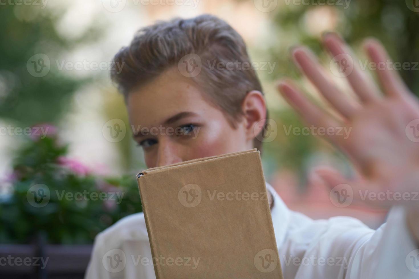 short haired woman reading walk in the fresh air education photo