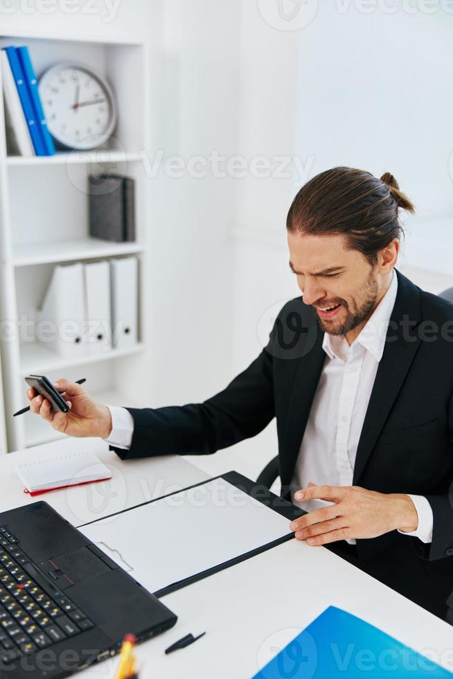 manager office work documents with a phone in hand boss photo