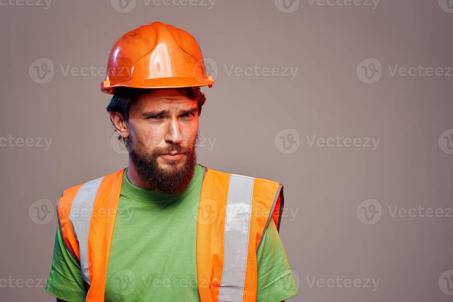 Man in working uniform orange paint safety work cropped view photo