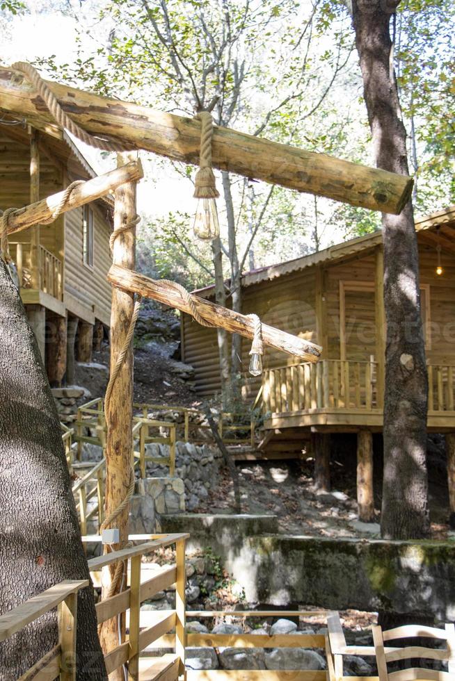 Old house in the middle of the forest with a wooden staircase. photo