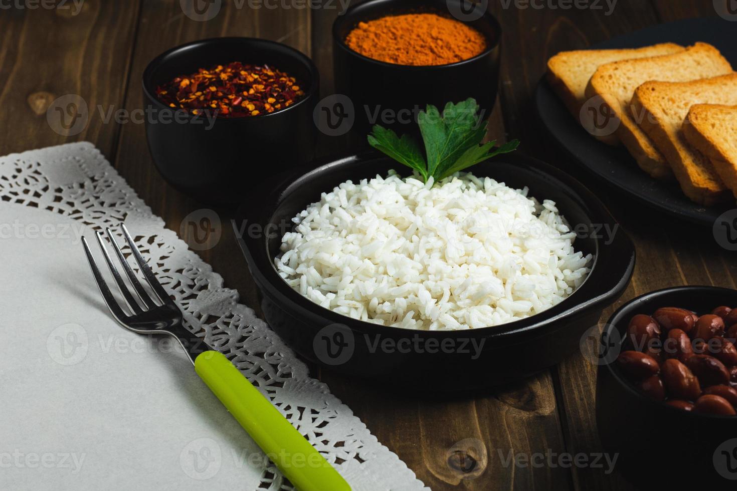 Dominican food with white rice and varius spices photo