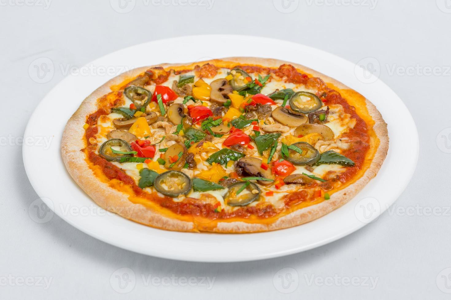 Hot fresh Chicken mushroom jalapeno pizza on white plate isolated white background. Homemade Pizza. Top views. photo