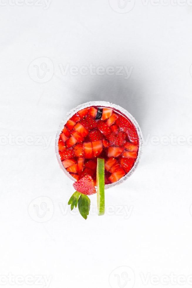 Top view of frozen strawberry and lime margarita. Valentine's dessert recipe. Strawberry juice. photo