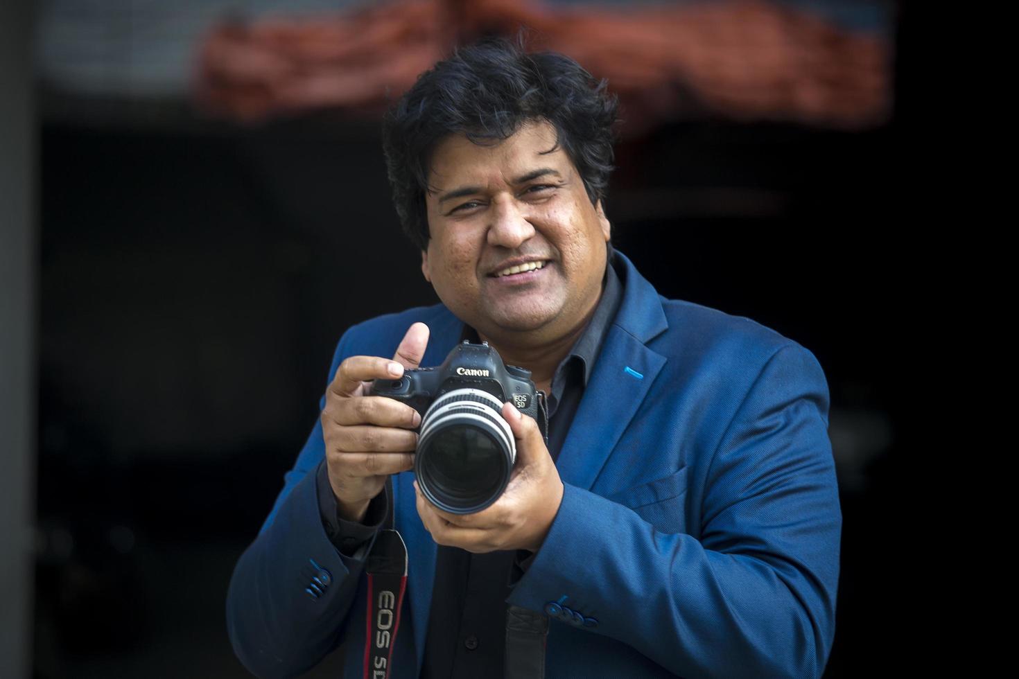 Bangladesh, January 24, 2018, Dipankar Dipon, One of the most popular Modern Film Director and Screenwriter is taking pictures with the dslr camera at Banani, Dhaka. photo