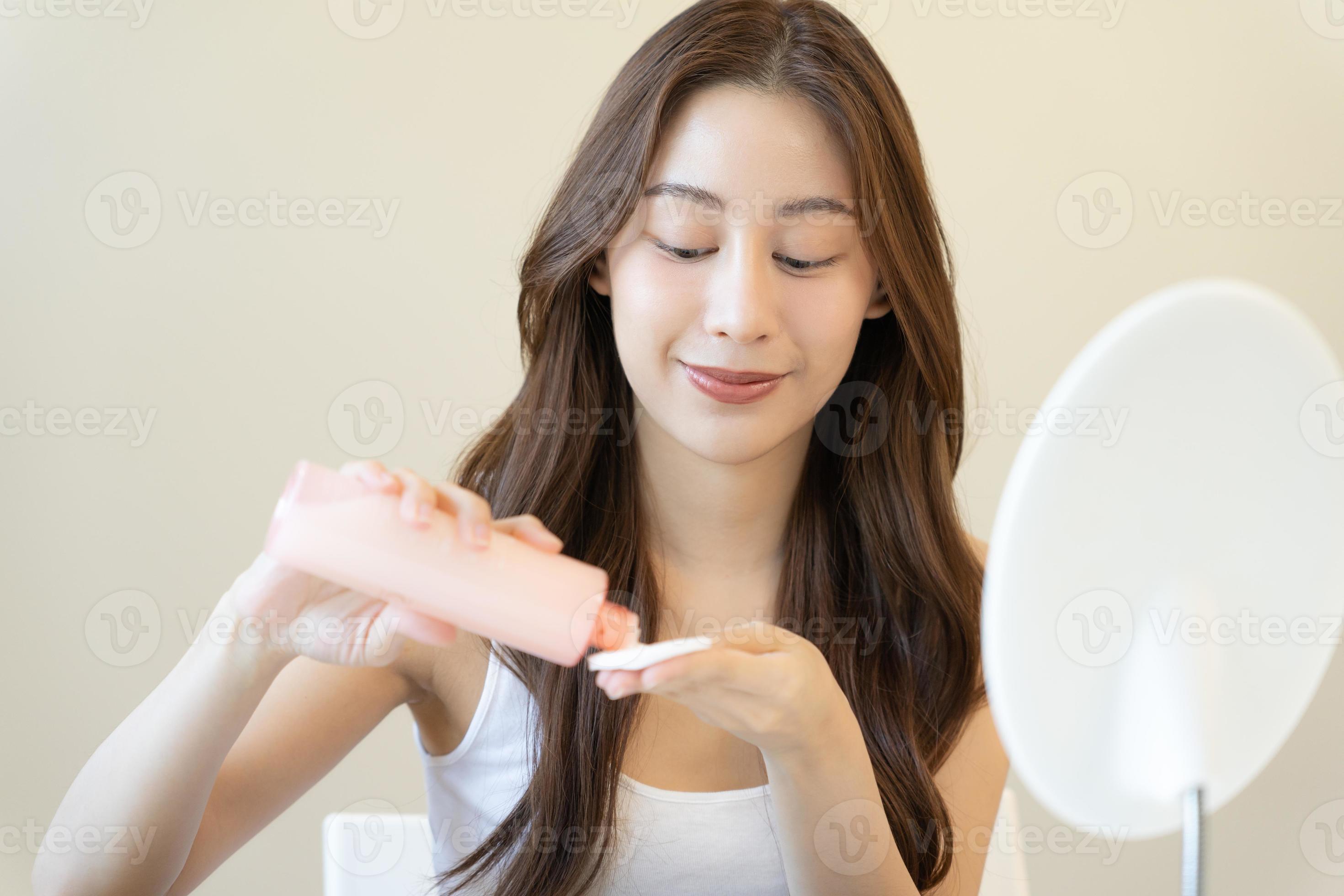 Beautiful Asian woman sit in front of a mirror. face of a healthy woman