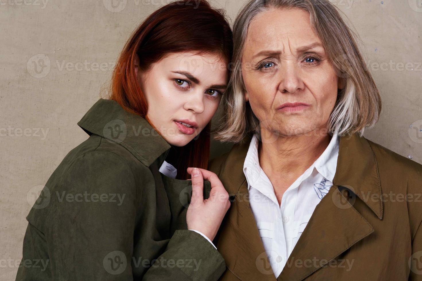 Mom and daughter in autumn coat fashion posing lifestyle photo