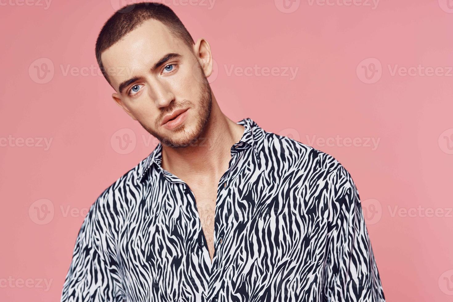 fashionable man shirt posing self confidence pink background photo