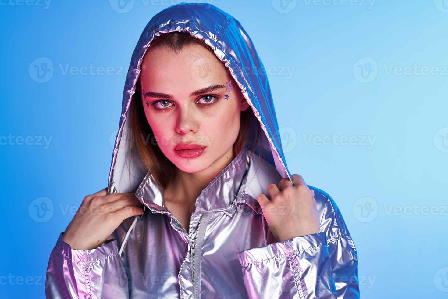 pretty woman silver jacket modern style nightclub blue background photo