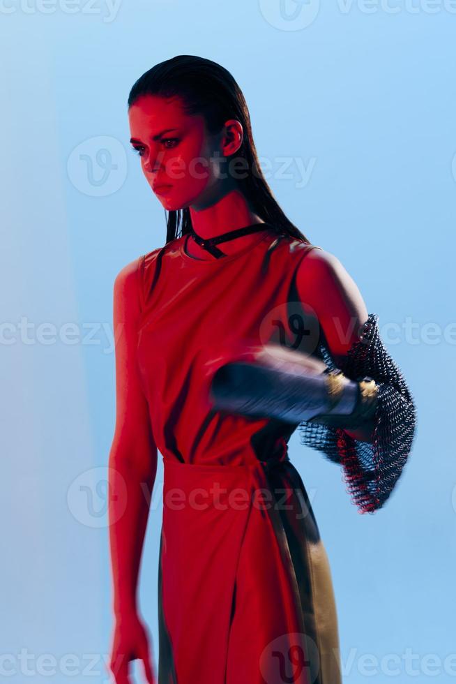photo pretty woman in dress arm in armor chain mail protection blue background