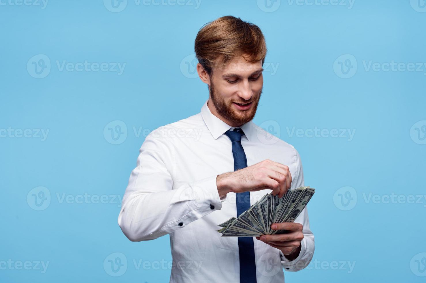 man in shirt with tie finance money in hands wealth photo
