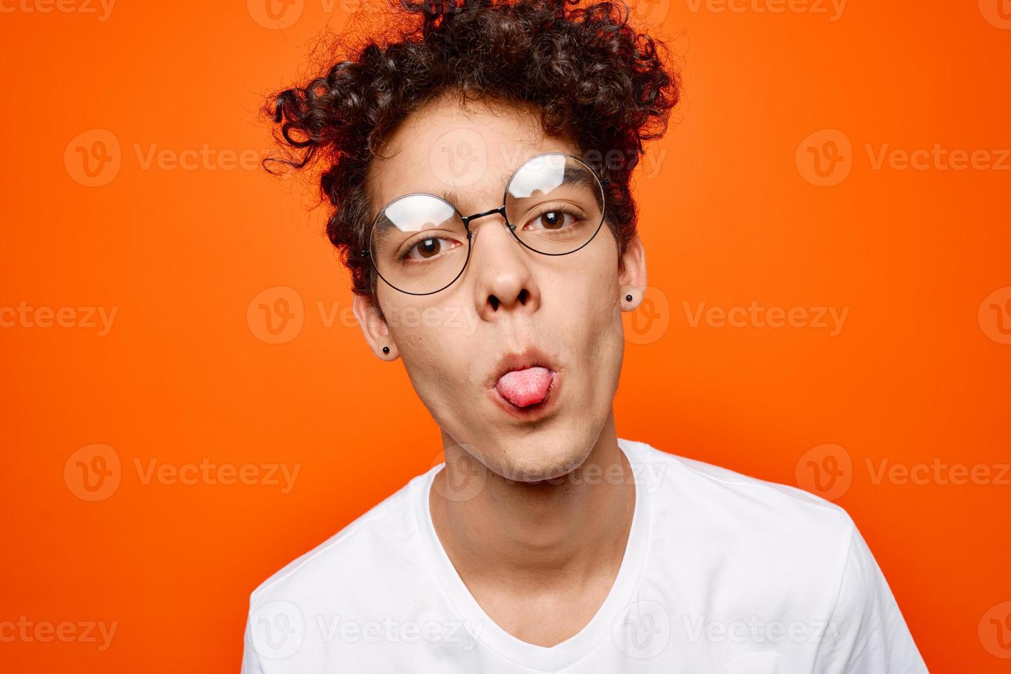 cute guy with curly hair wearing glasses white t-shirt close-up photo