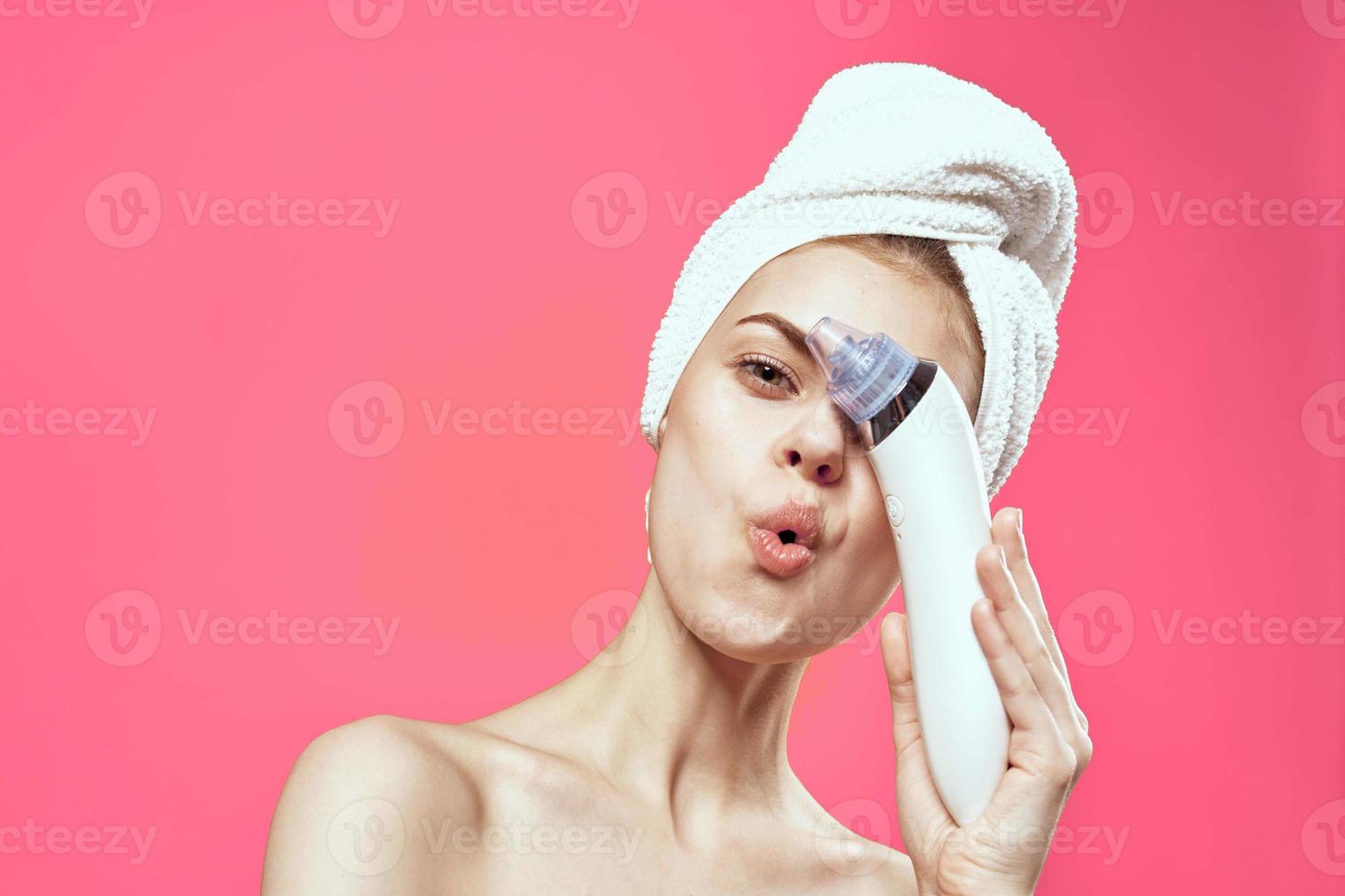 woman with towel on head cleaning skin therapy cosmetics technology photo