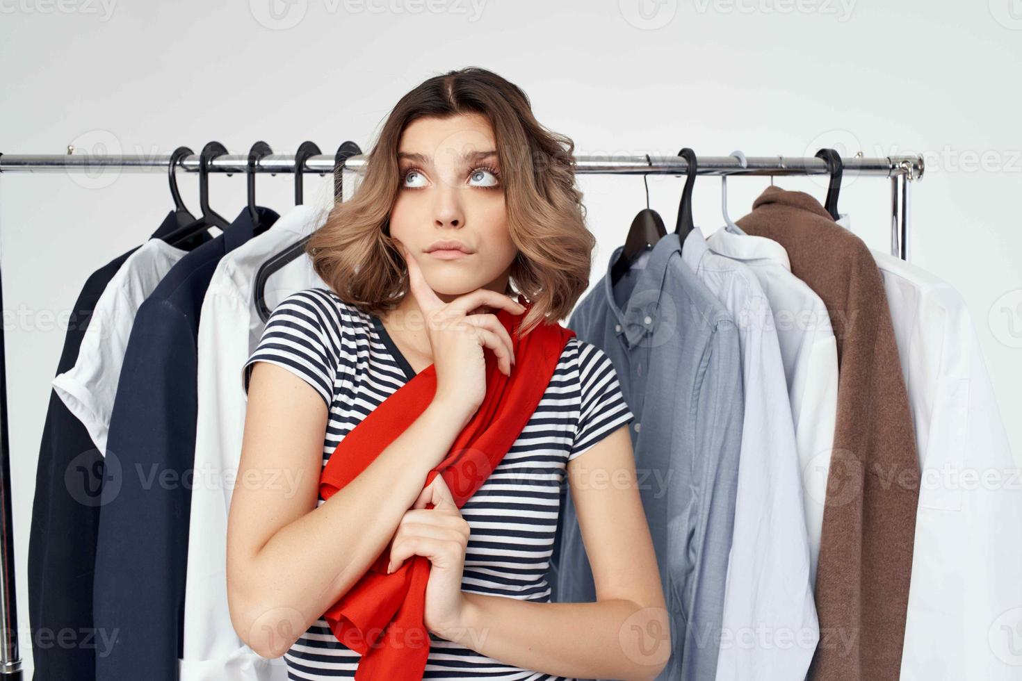 beautiful woman clothes hanger shopping light background photo