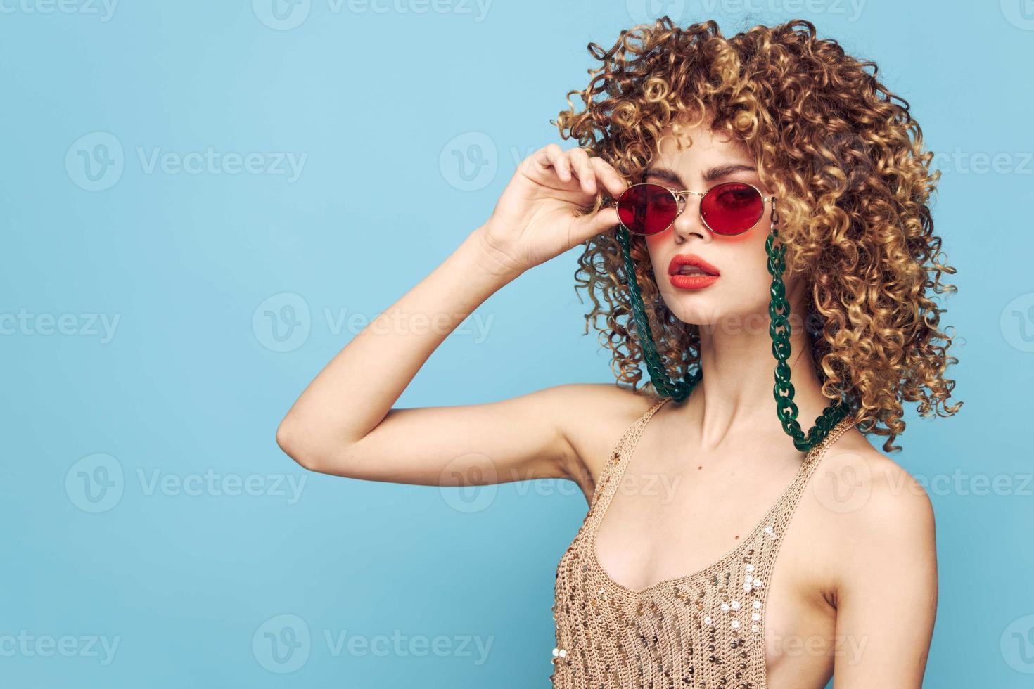 Cheerful lady expression of feelings on a blue background, studio photo