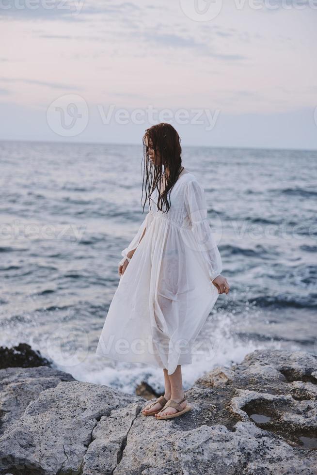 Beautiful woman walks volcanic rock formations on the island nature photo