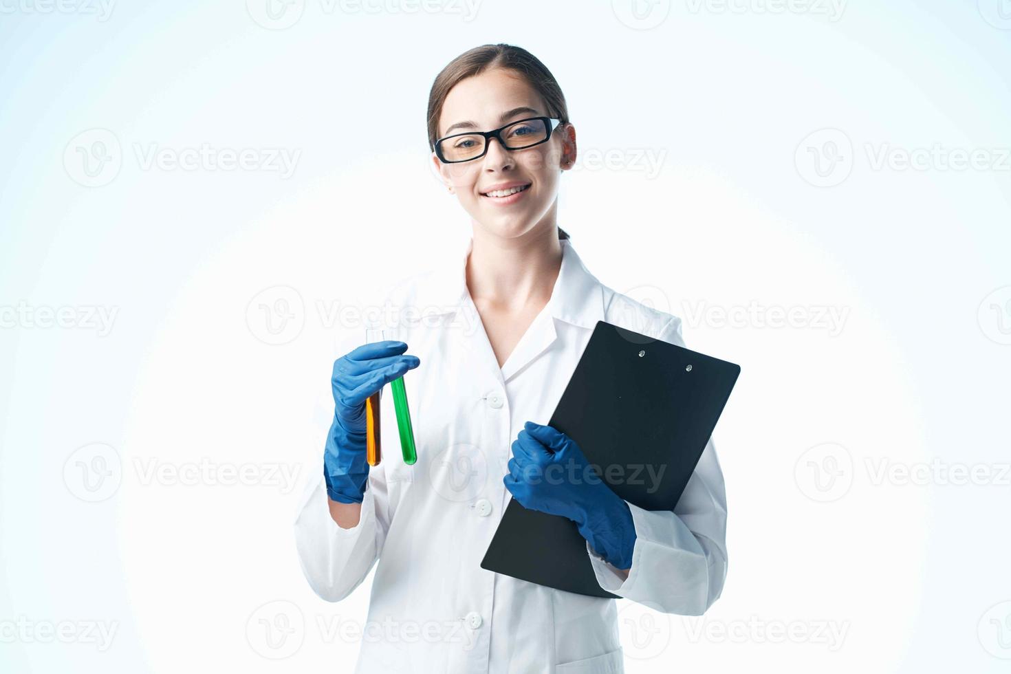 cheerful woman laboratory assistant chemical solution analyzes research light background photo