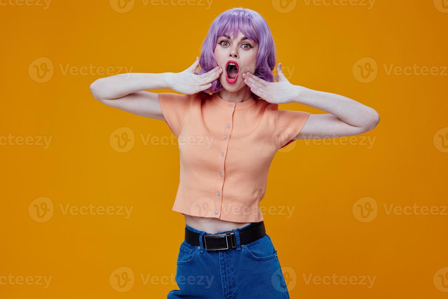Beautiful fashionable girl wavy purple hair emotions fun color background unaltered photo
