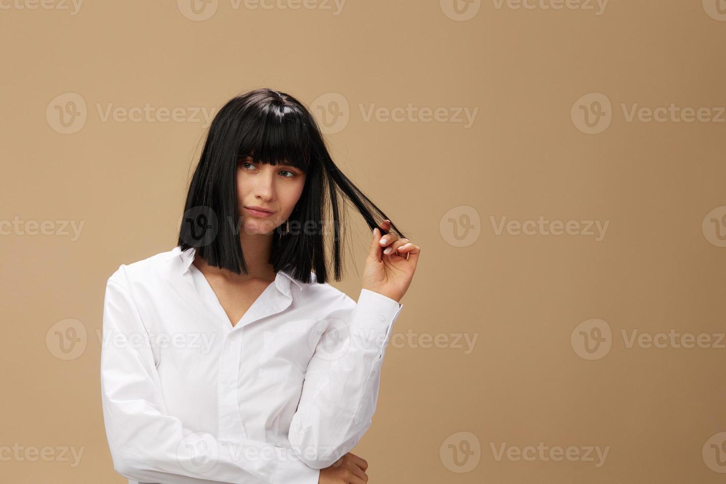 Pretty sexy beautiful stylish adorable brunet lady in white shirt posing isolated on pastel beige studio background. Copy space Banner Offer. Pulp Fiction concept. Fashion Cinema photo