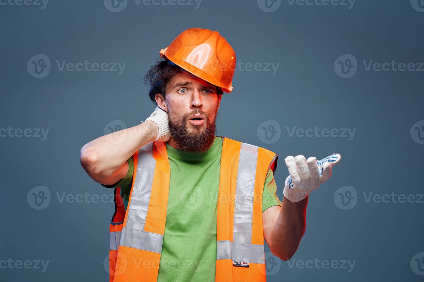 A bearded man in a builder in the form of emotions of a security Professional photo