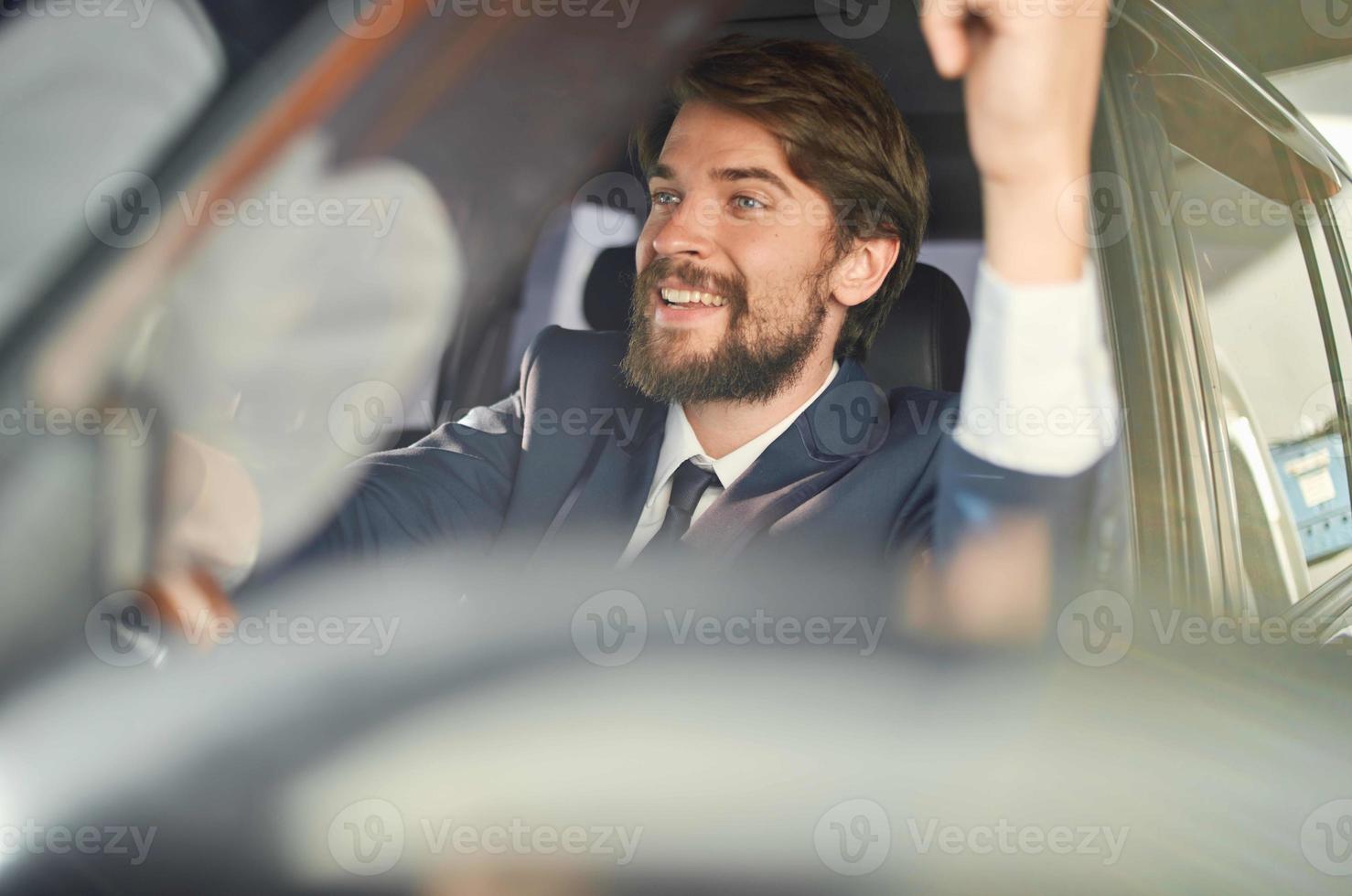 bearded man Driving a car trip luxury lifestyle self confidence photo