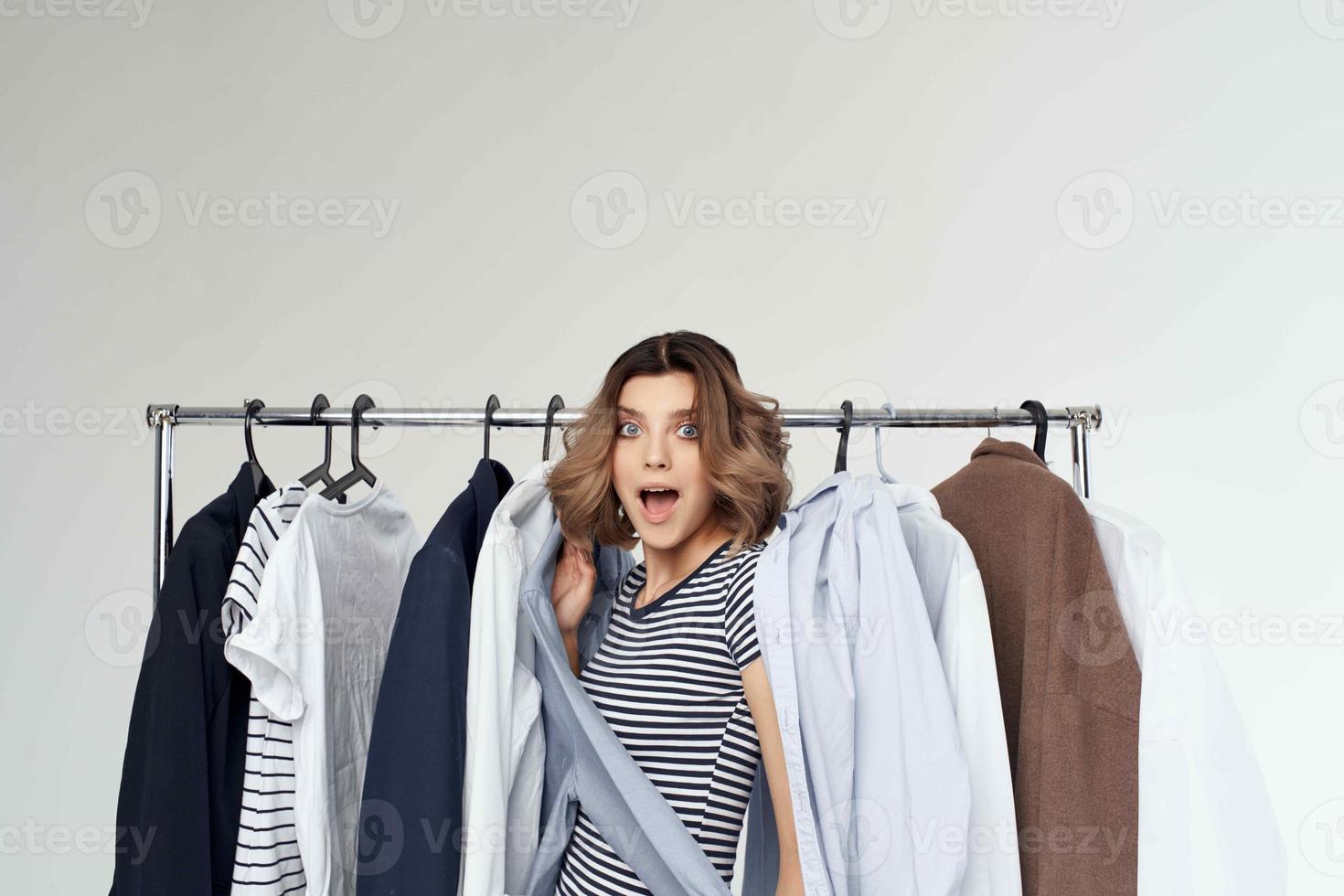 beautiful woman trying on clothes shop retail isolated background photo