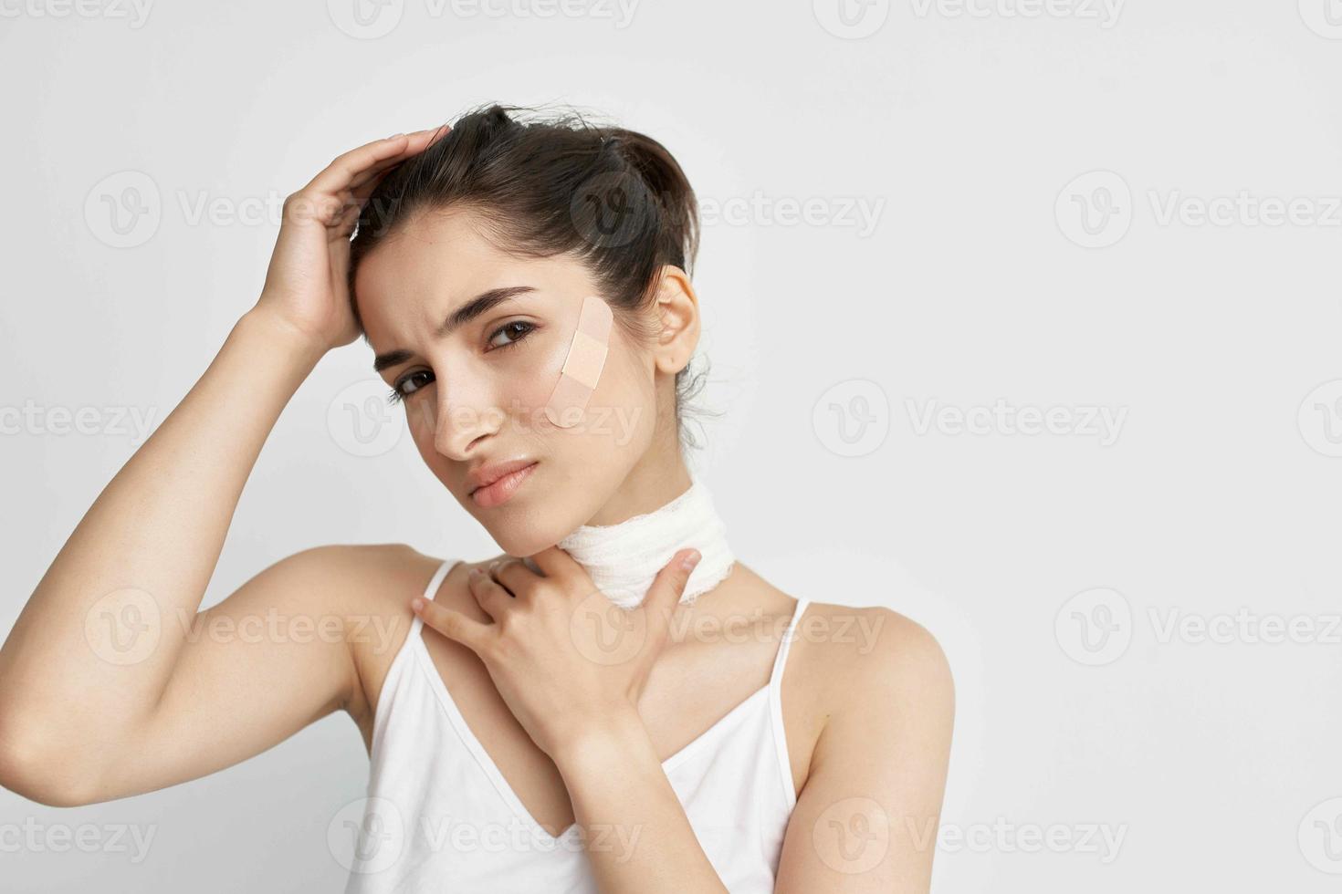 woman holding his head trauma health problems light background photo