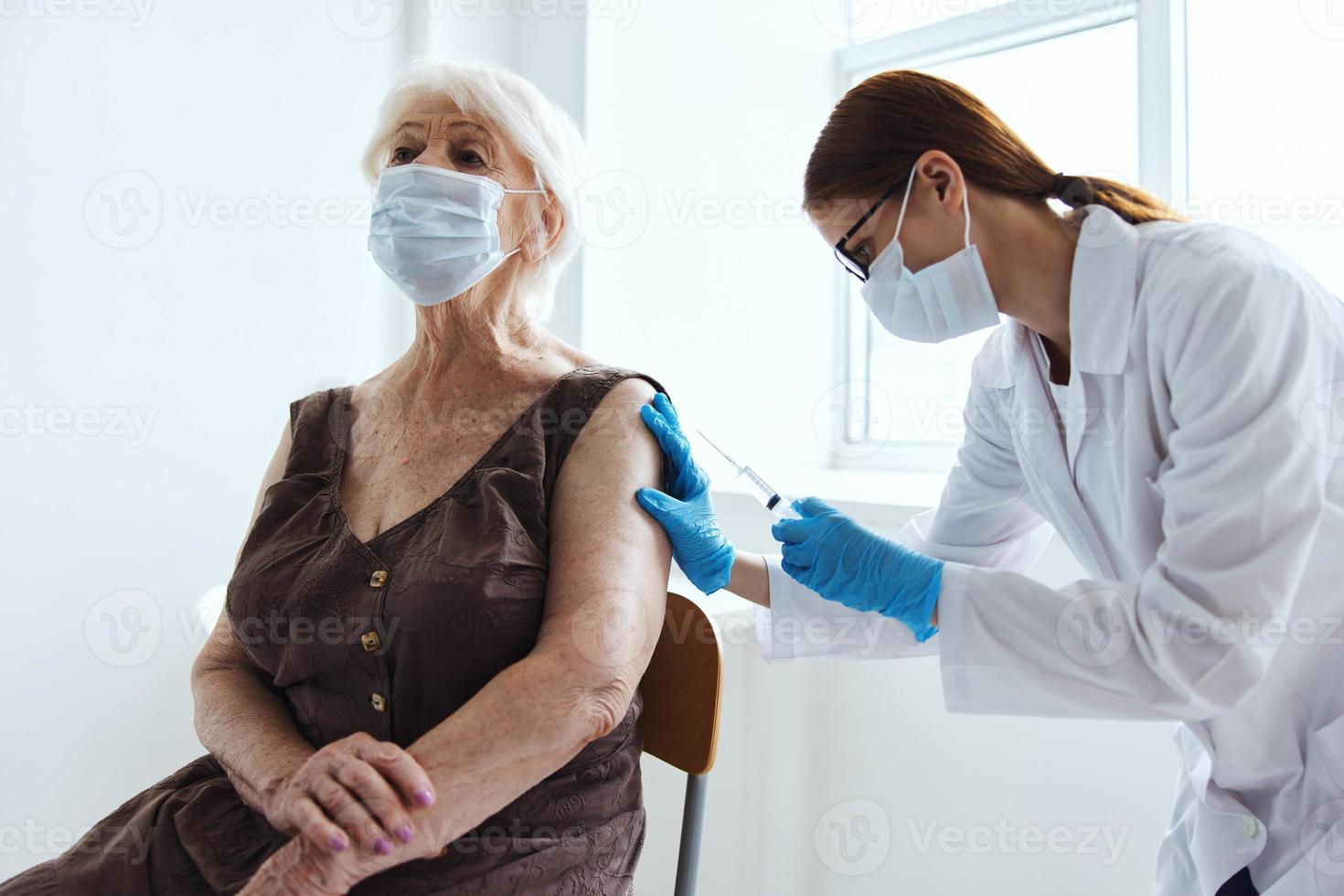 female doctor syringe with vaccine immunity protection photo