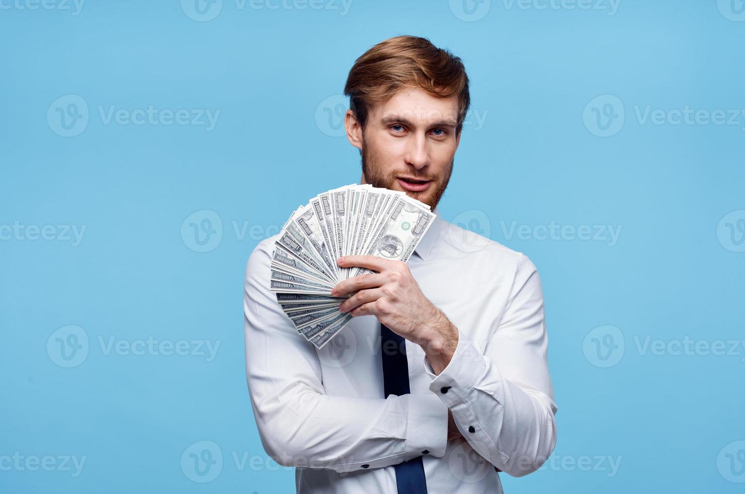 man in white shirt bundle of money wealth dollars finance photo