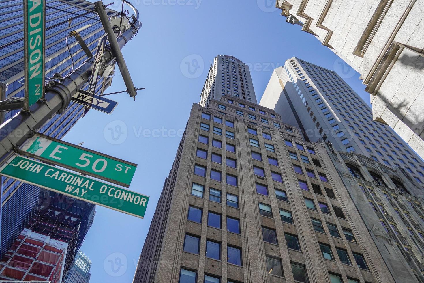 new york manhattan skyscrapers view from the street to the top of the building on sunny clear day photo