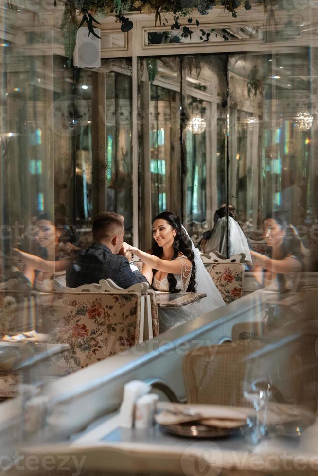 bride and groom inside a cocktail bar photo