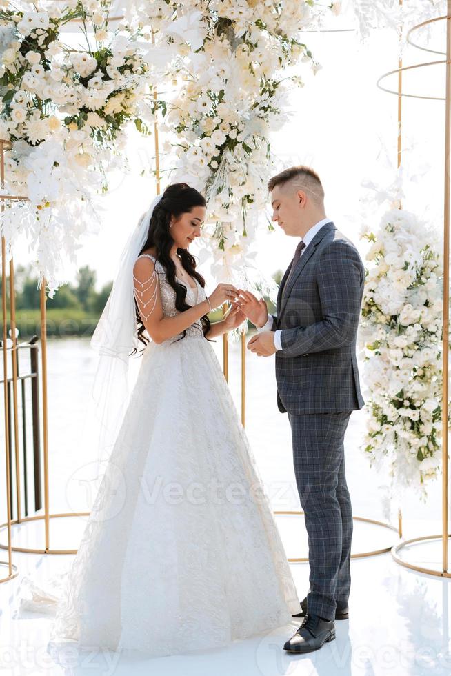 wedding ceremony of the newlyweds on the pier photo