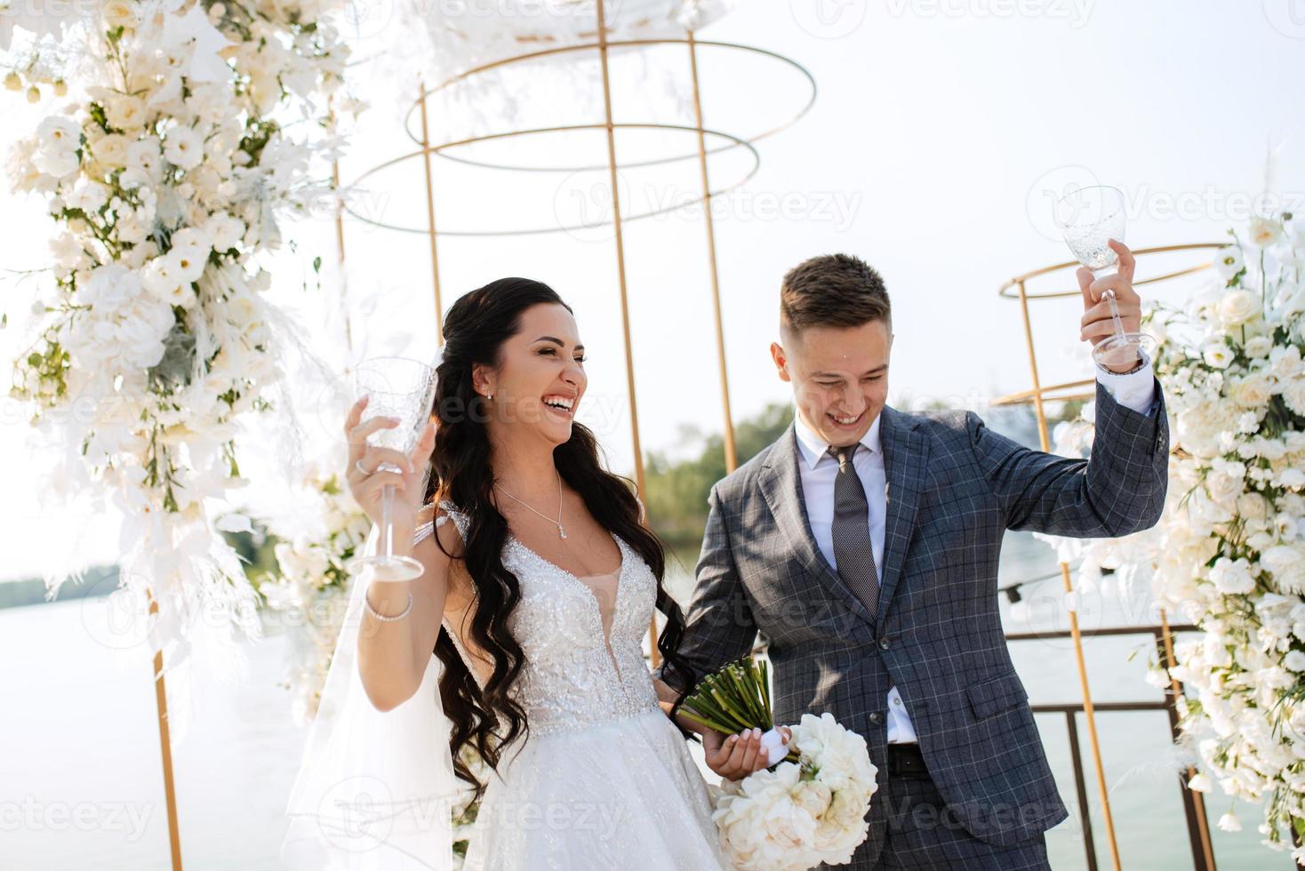 wedding ceremony of the newlyweds on the pier photo