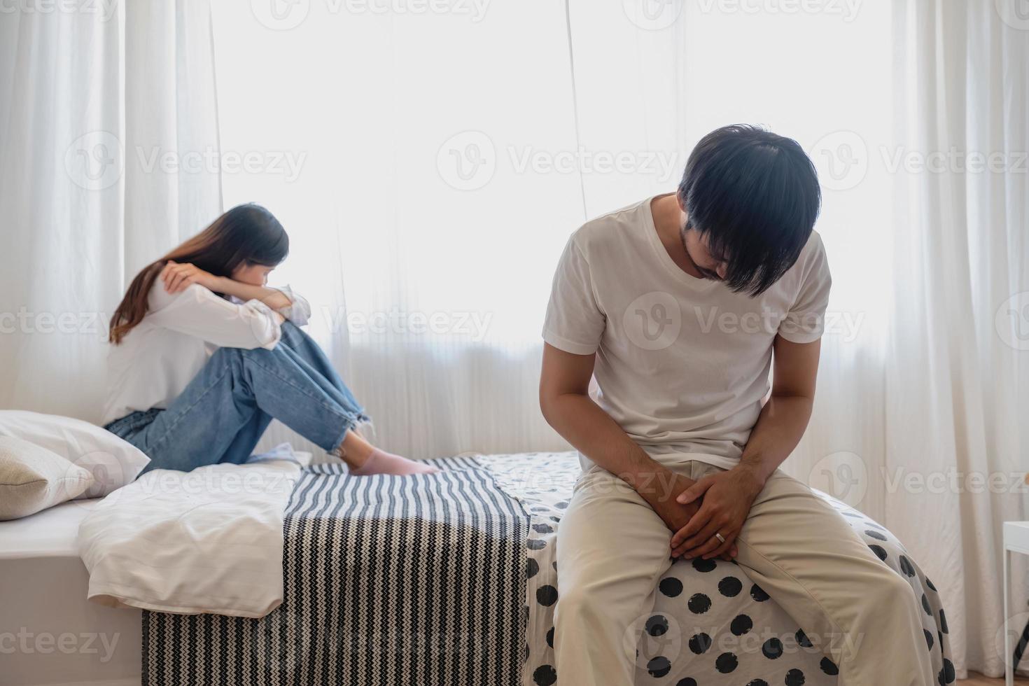 The husband is unhappy and disappointed in the erectile dysfunction during sex while his wife sleeping on the image