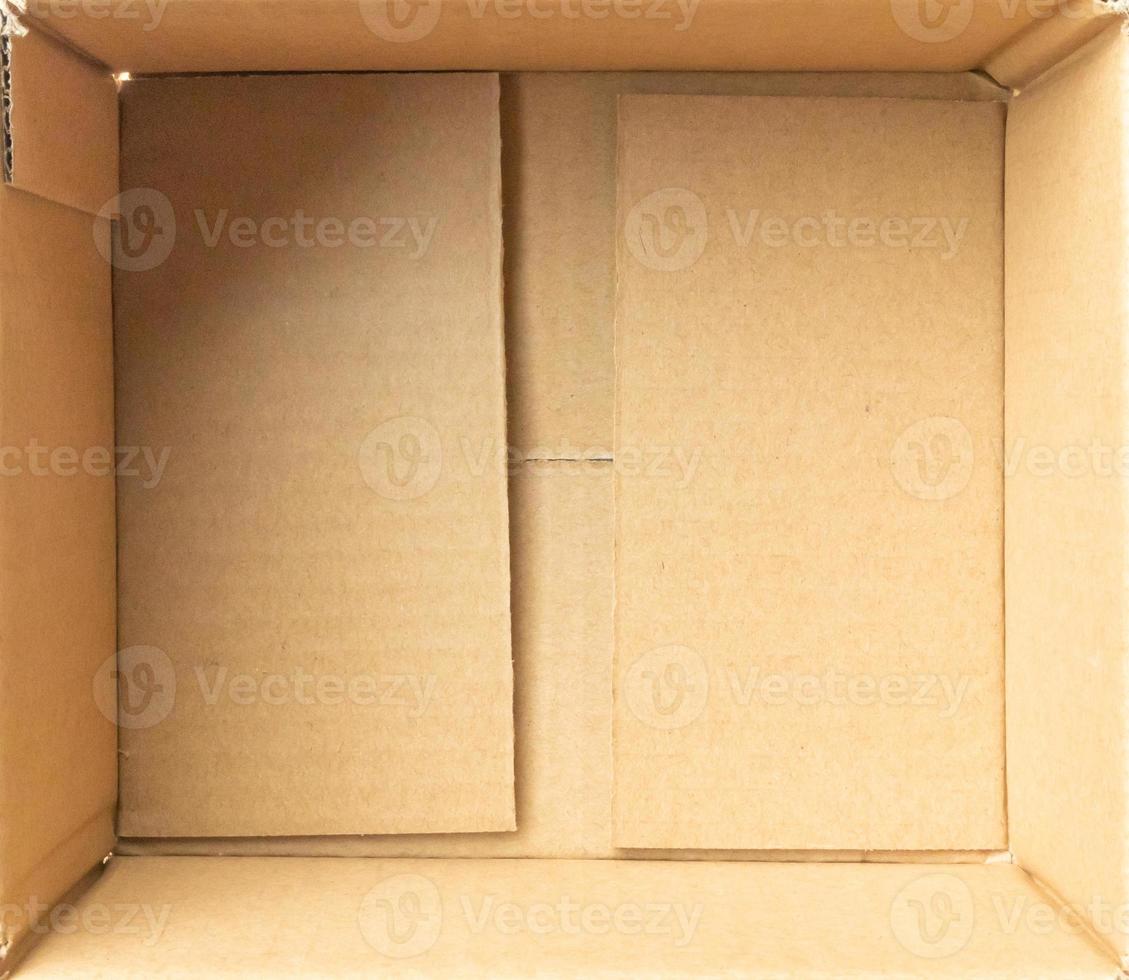 Open empty brown cardboard box background top view photo