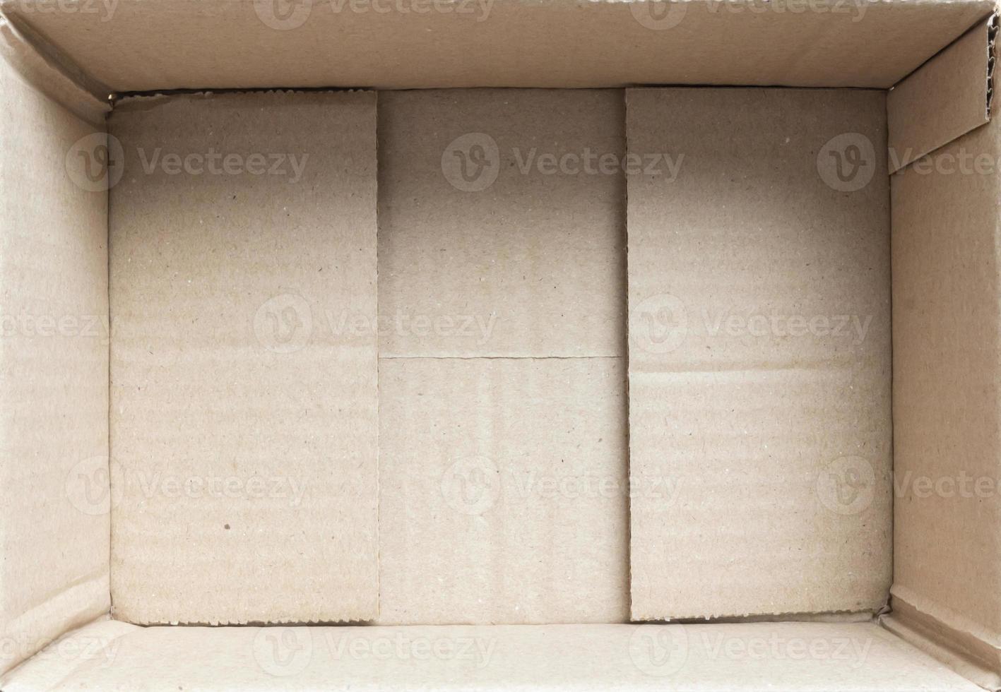 Open empty brown cardboard box background top view photo