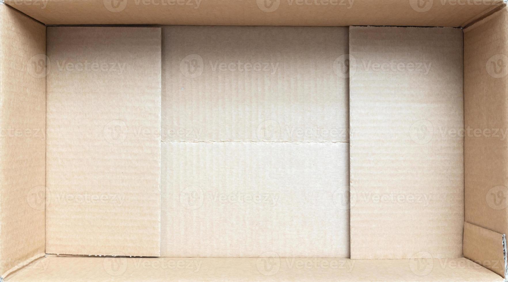 Open empty brown cardboard box background top view photo