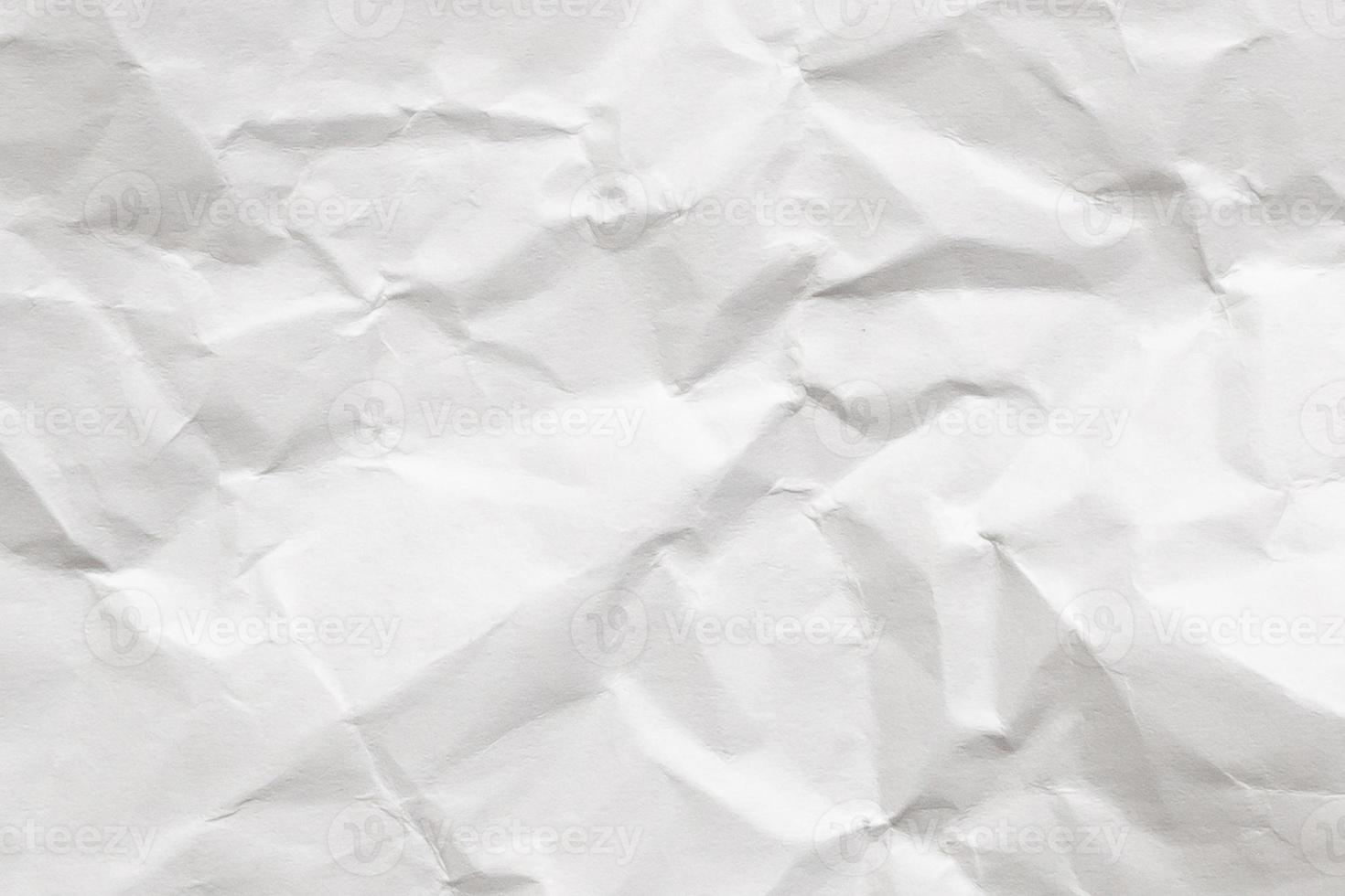 Abstract white crumpled and creased recycle paper texture background photo