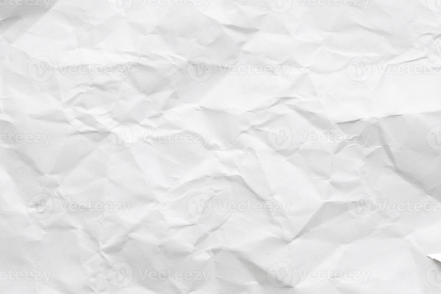 Abstract white crumpled and creased recycle paper texture background photo