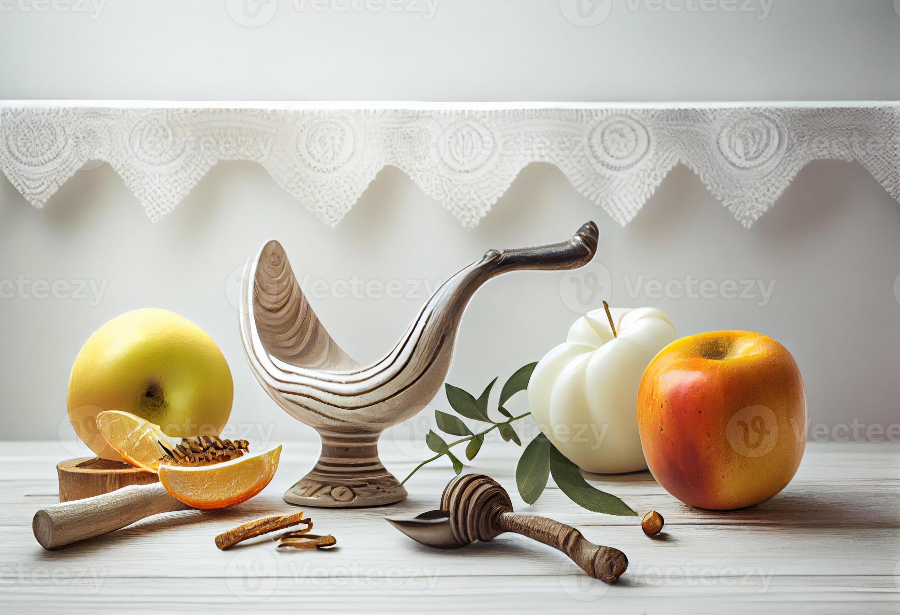 Shofar and other Rosh Hashanah holiday attributes on white wooden table
