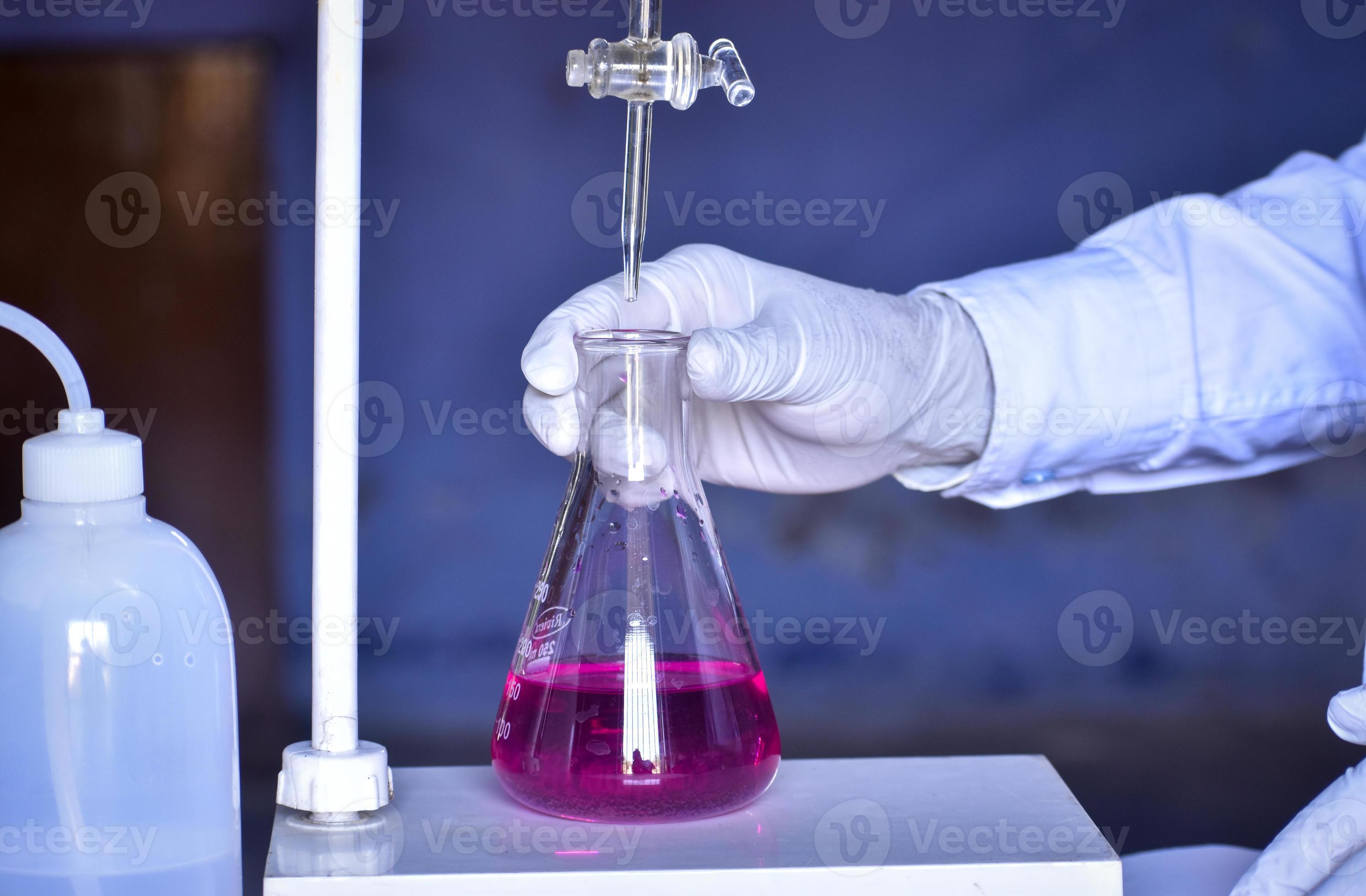 The chemist measures with precision in acidbase titration, adding