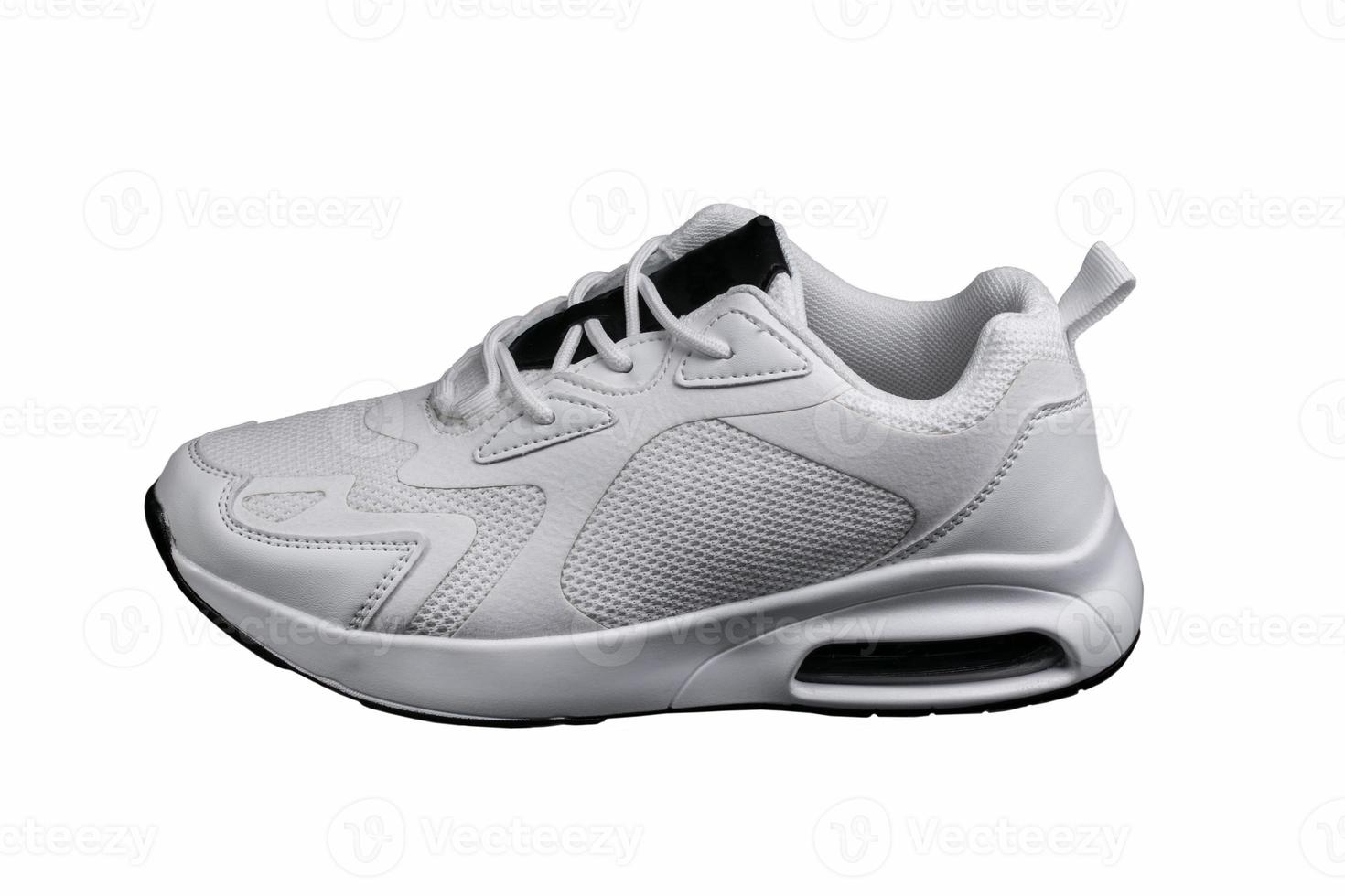 White sneaker with black accents isolated. Sports shoes on a white background. photo