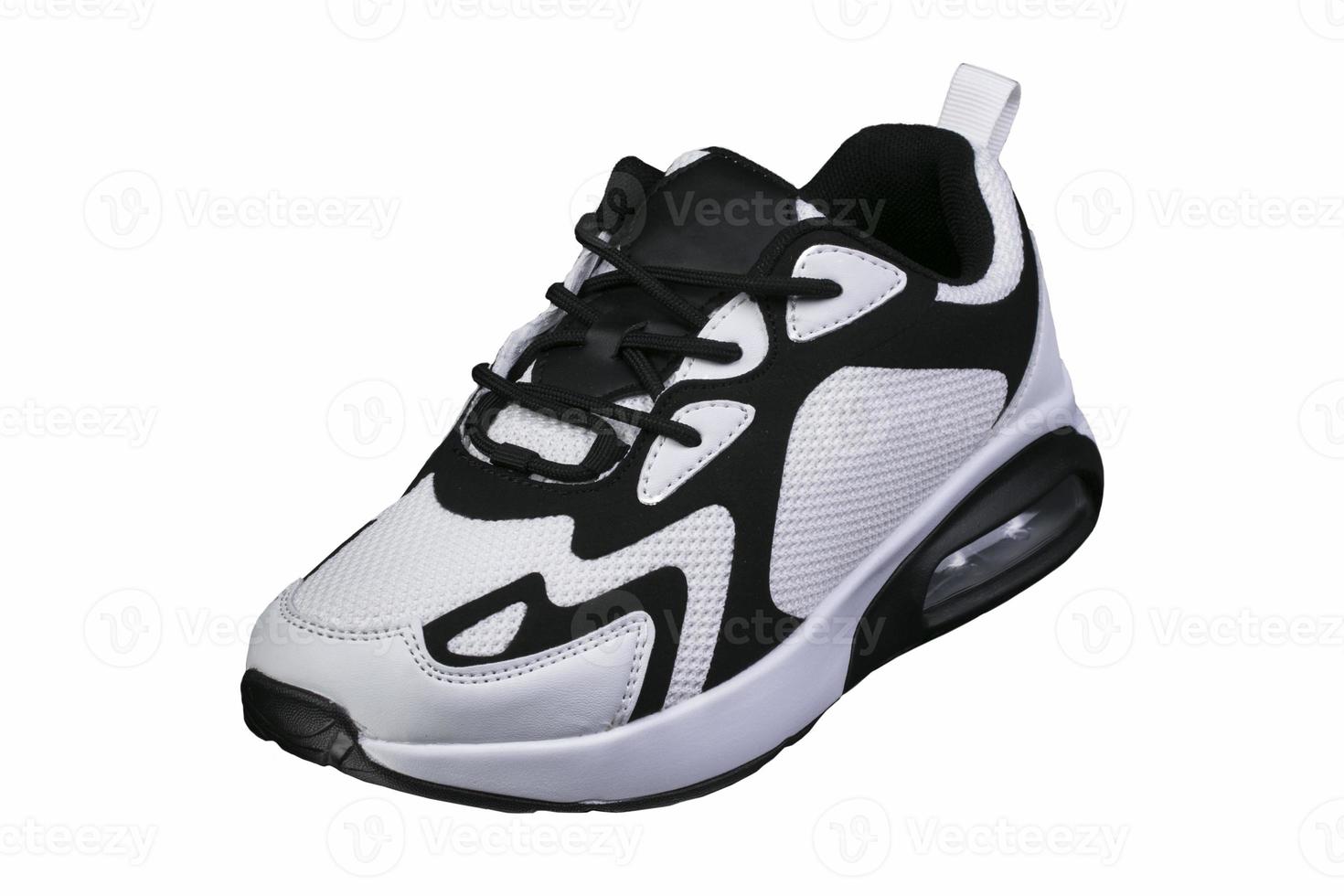 White sneaker with black accents on a white background. Sport shoes. photo